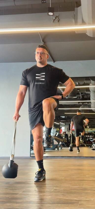 Athlete setting up for a heavy barbell deadlift